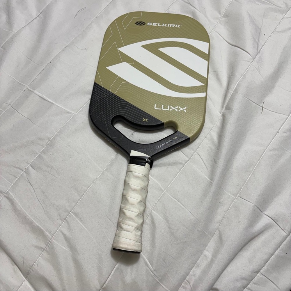 Used tan selkirk pickleball paddle.